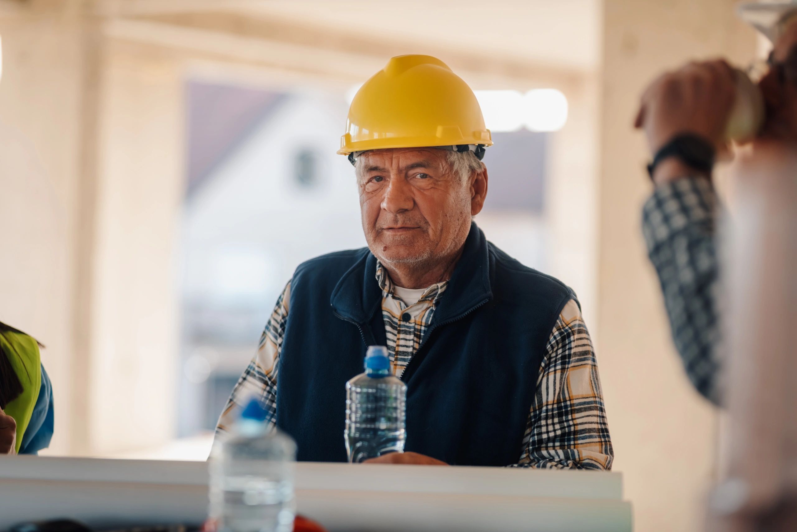 Construction worker taking a break with colleagues on a building site