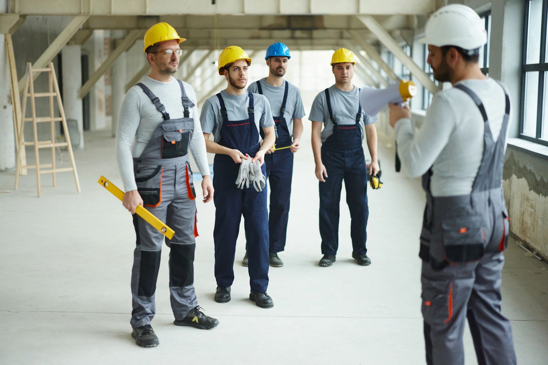 Construction crew on a jobsite listening to instructions